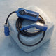 Blue CEE portable charging cable coiled on a block of ice