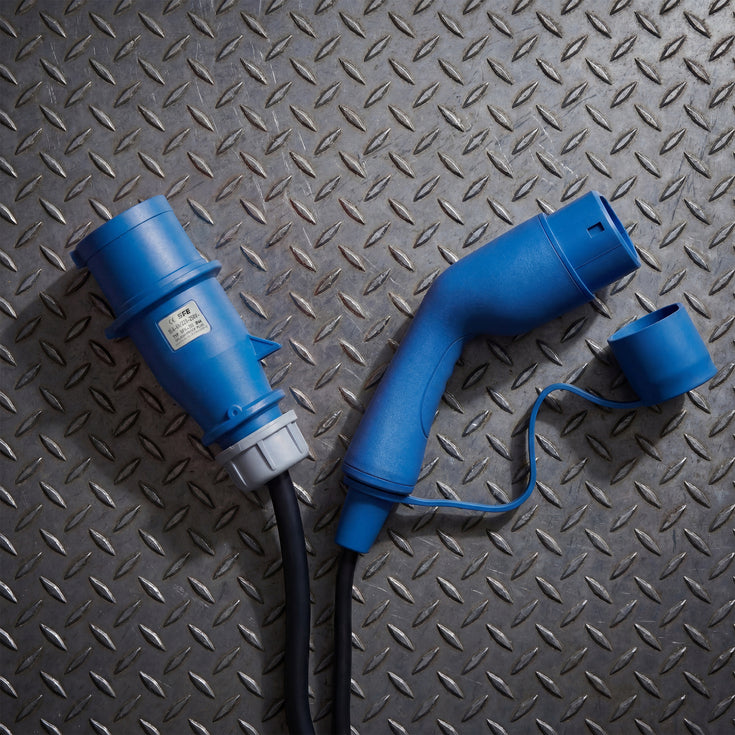 Blue CEE industrial plug and Type 2 connector on a diamond plate steel surface